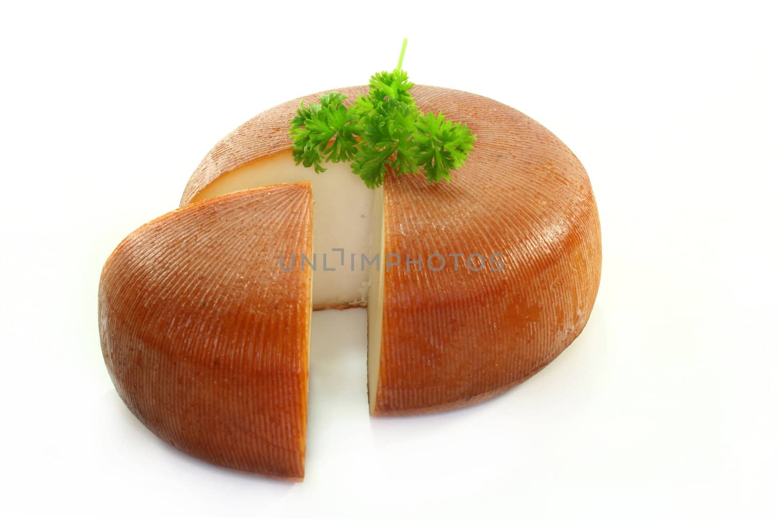 a loaf of smoked goat cheese on a white background