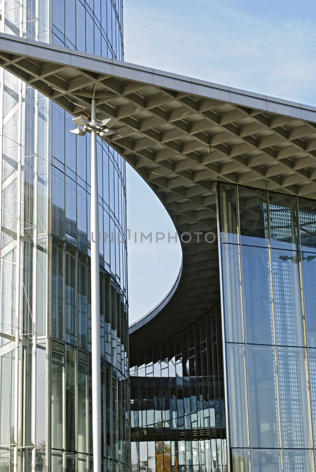 Modern building of glass and metal on blue sky background in Germany