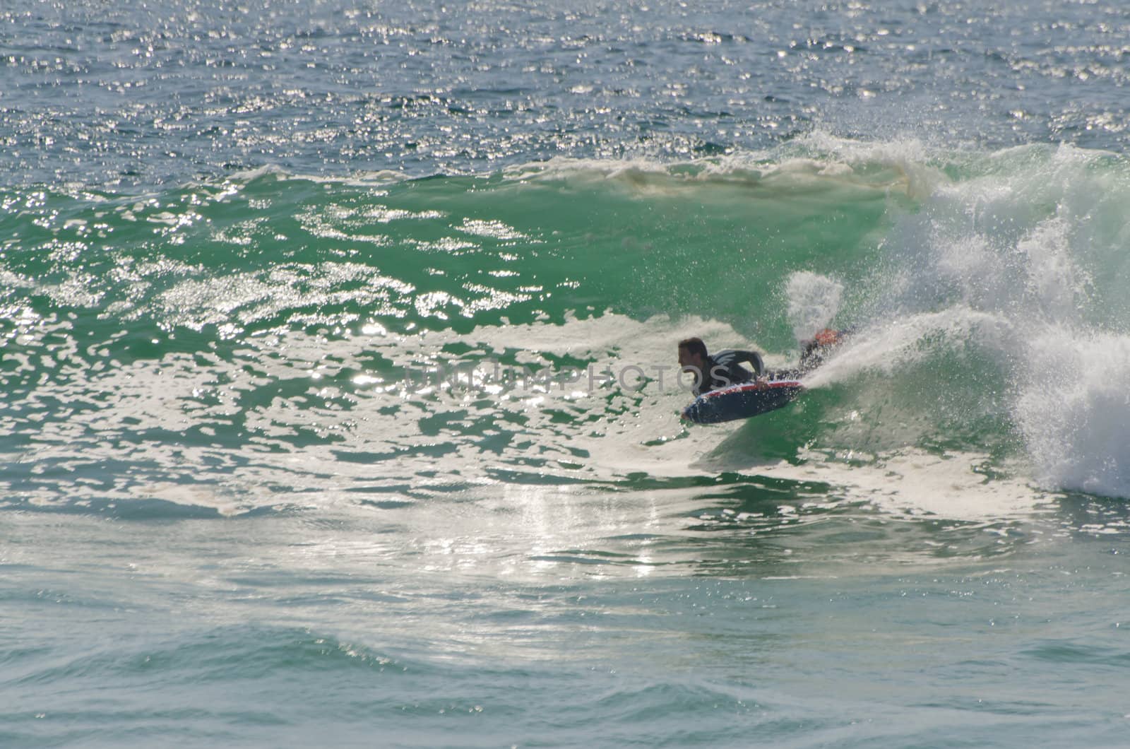 body boarder riding a big wave by homydesign
