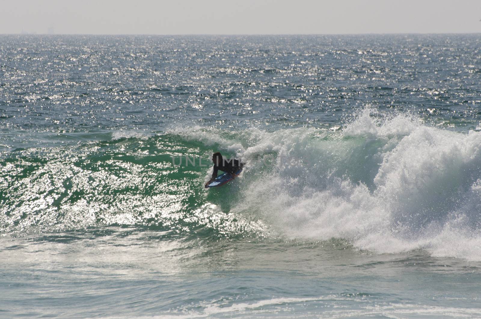 body boarder riding a big wave by homydesign