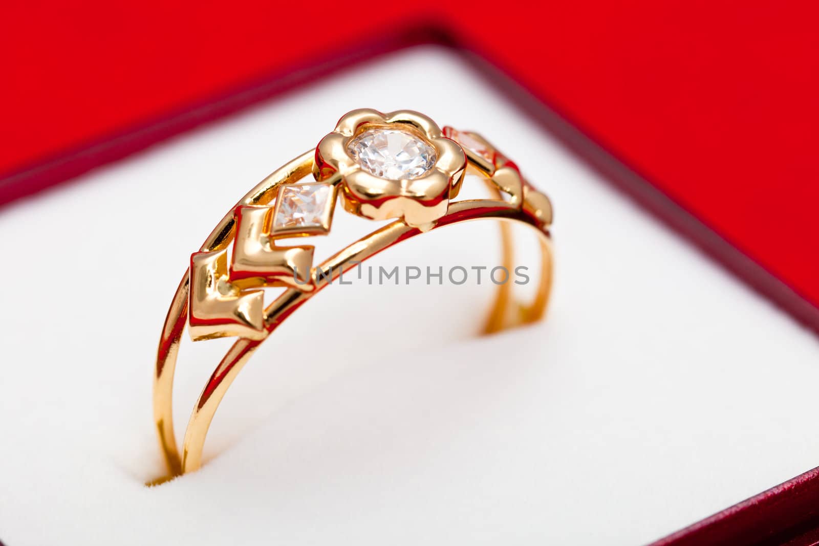 Fantastic gold ring adorned with several white zirconia