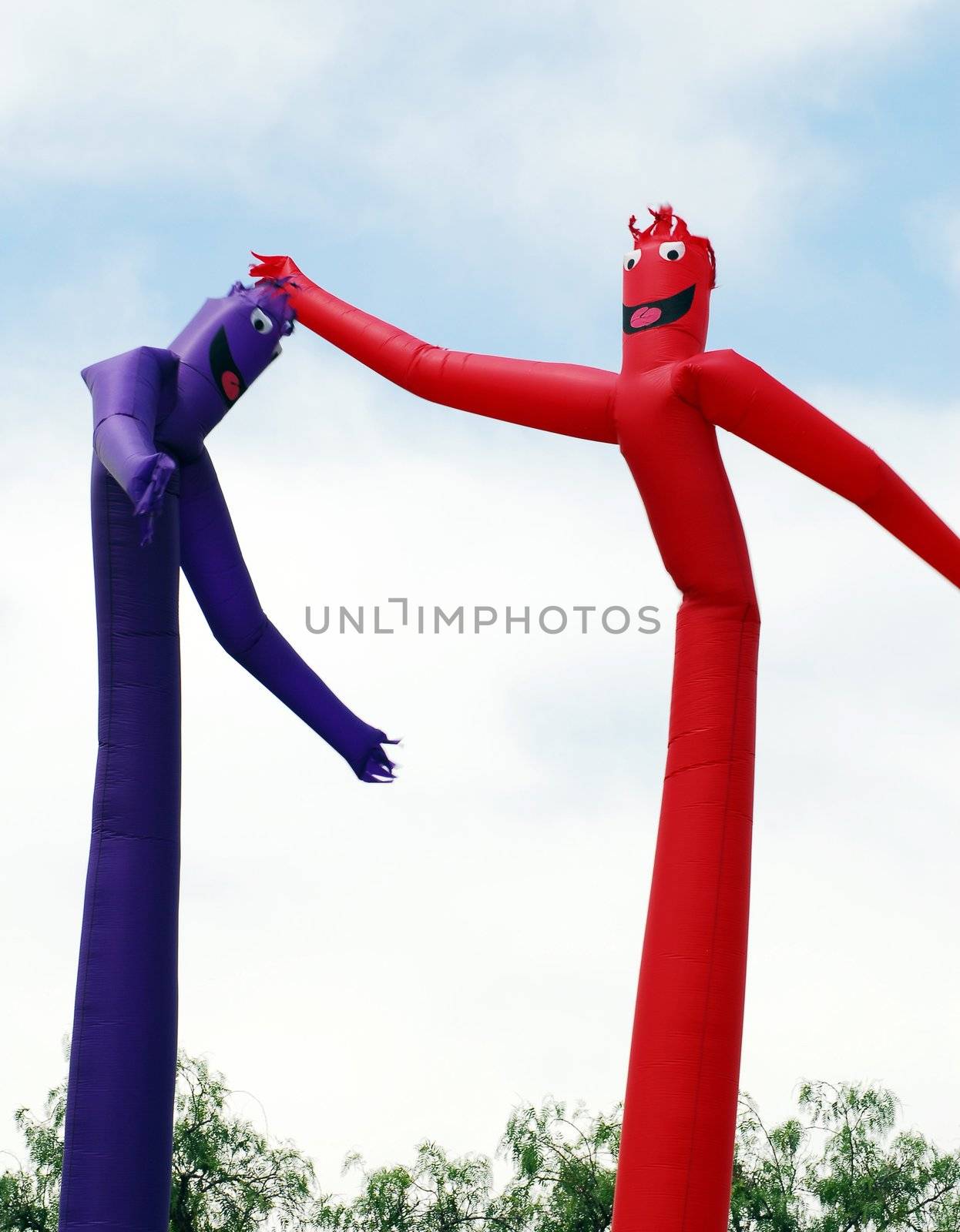 red and blue inflated human figure balloons for decoration