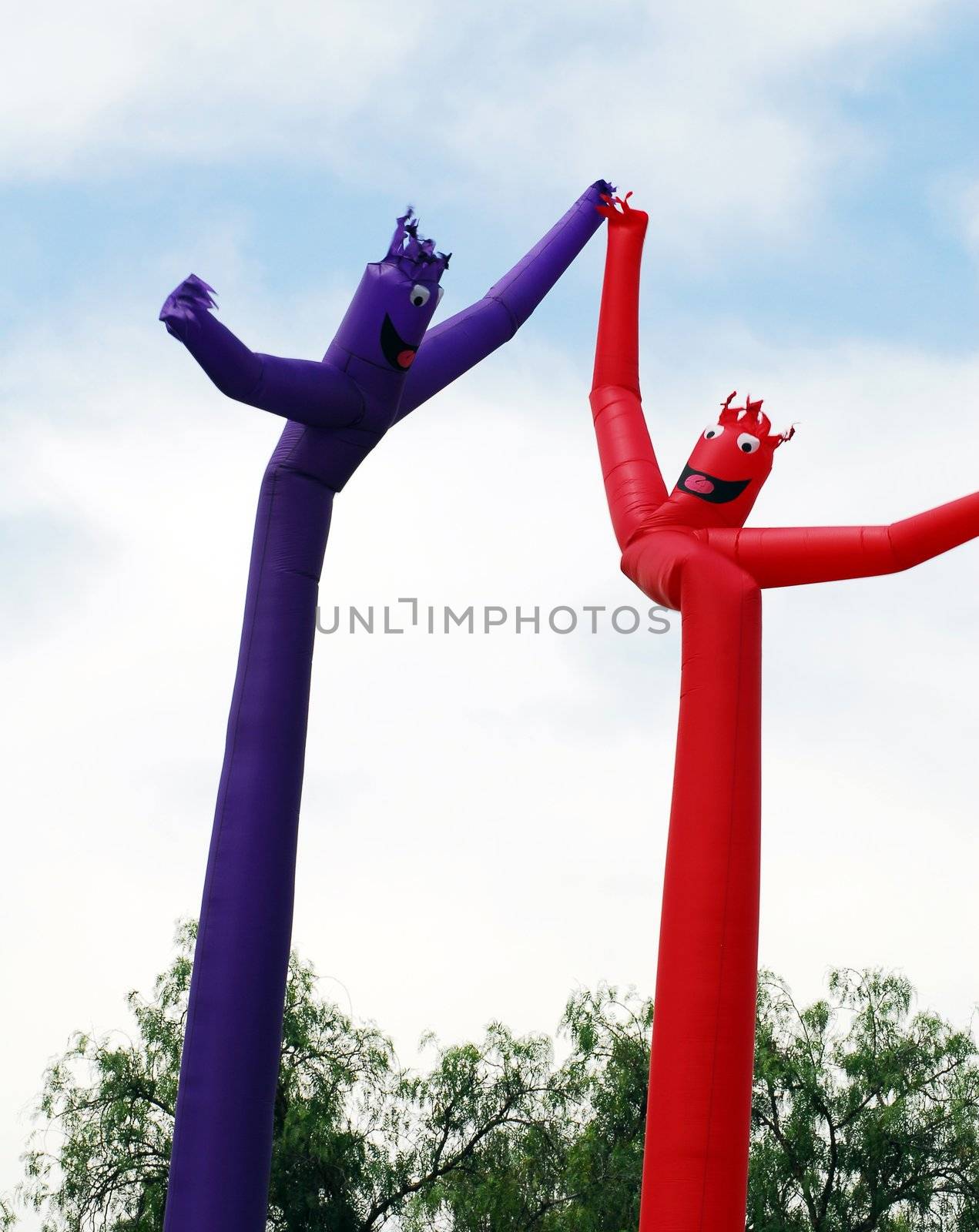 red and blue inflated human figure balloons for decoration