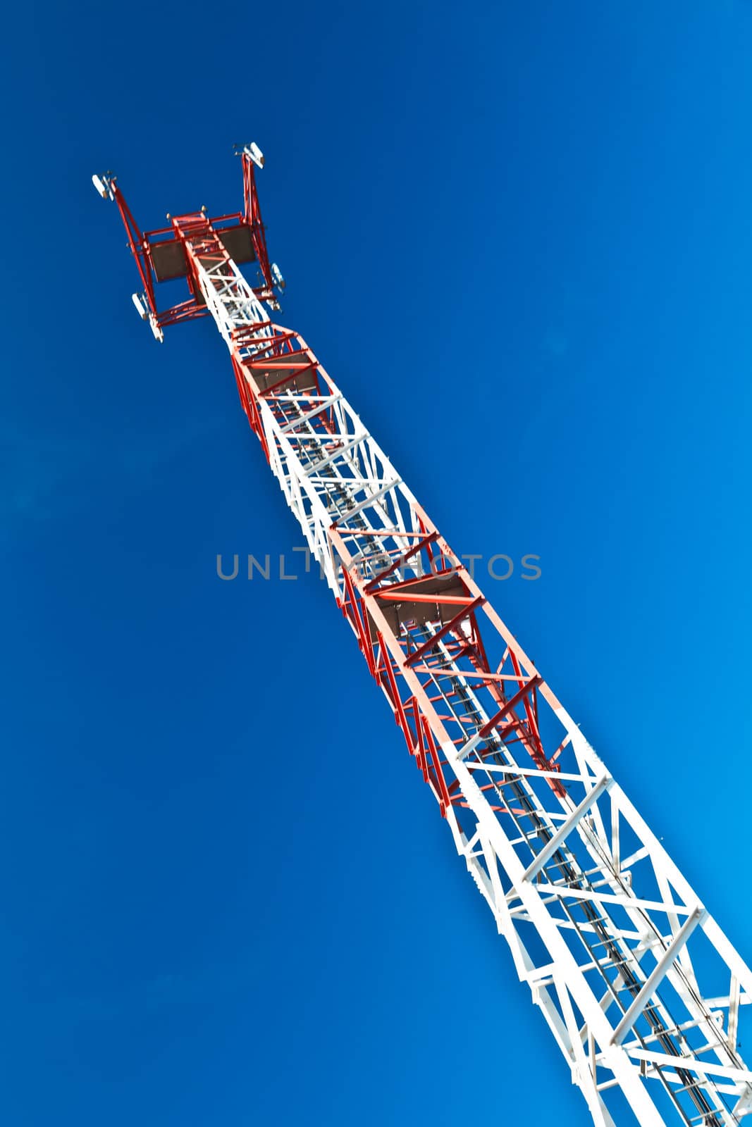 Communications tower with a beautiful blue sky