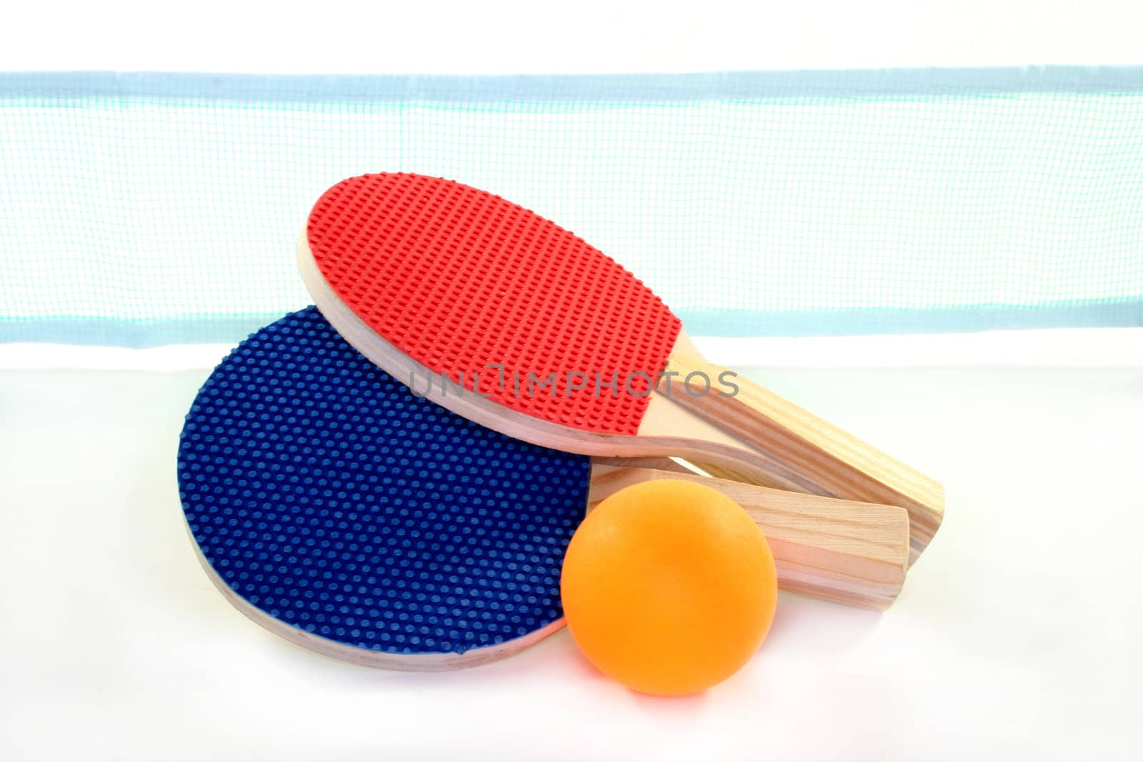two table tennis bats, net and ball on a white background