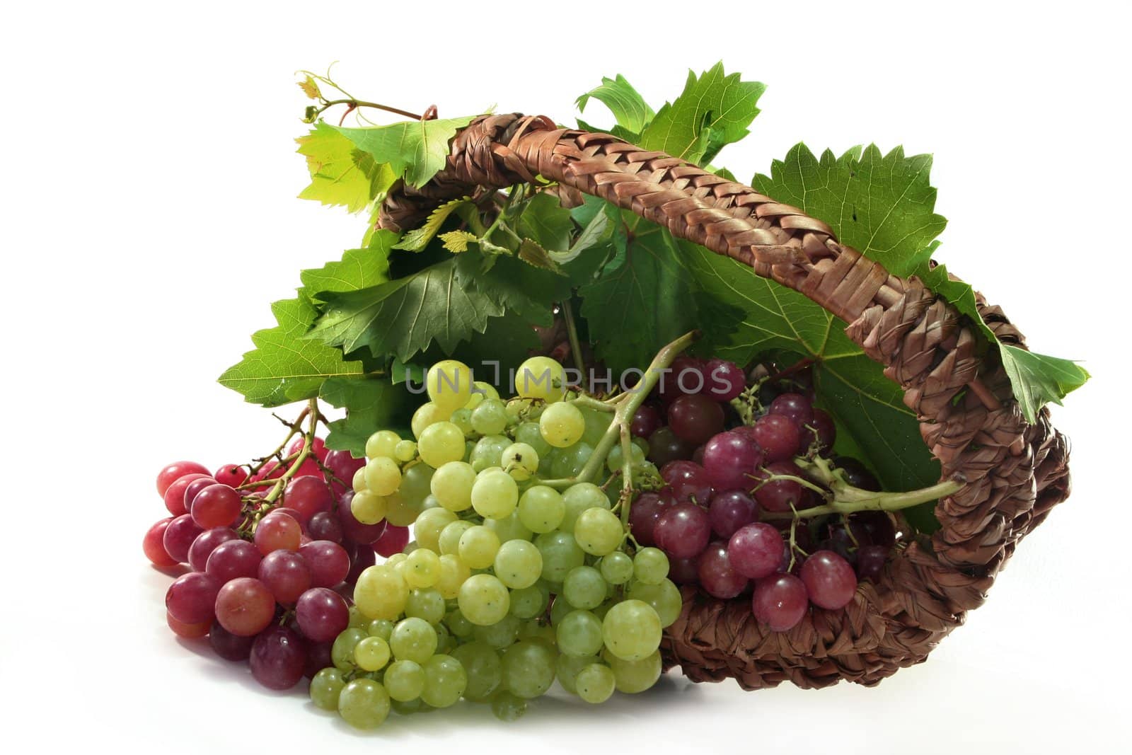 Grapes and vine leaves in a basket