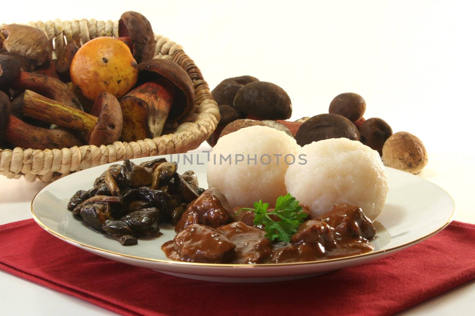 Venison goulash with dumplings and fresh mushrooms