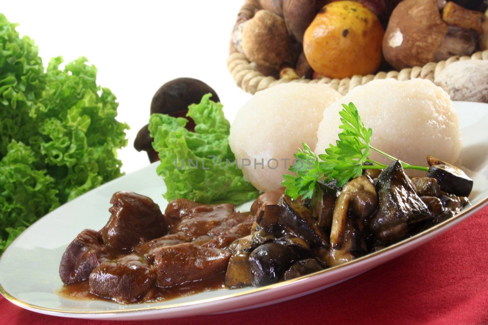 Venison goulash with dumplings and fresh mushrooms