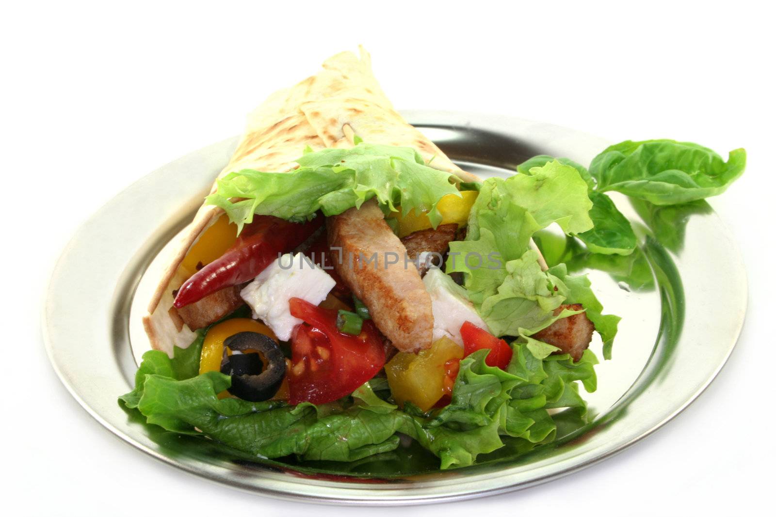 Tortilla filled with cheese, turkey breast and vegetables