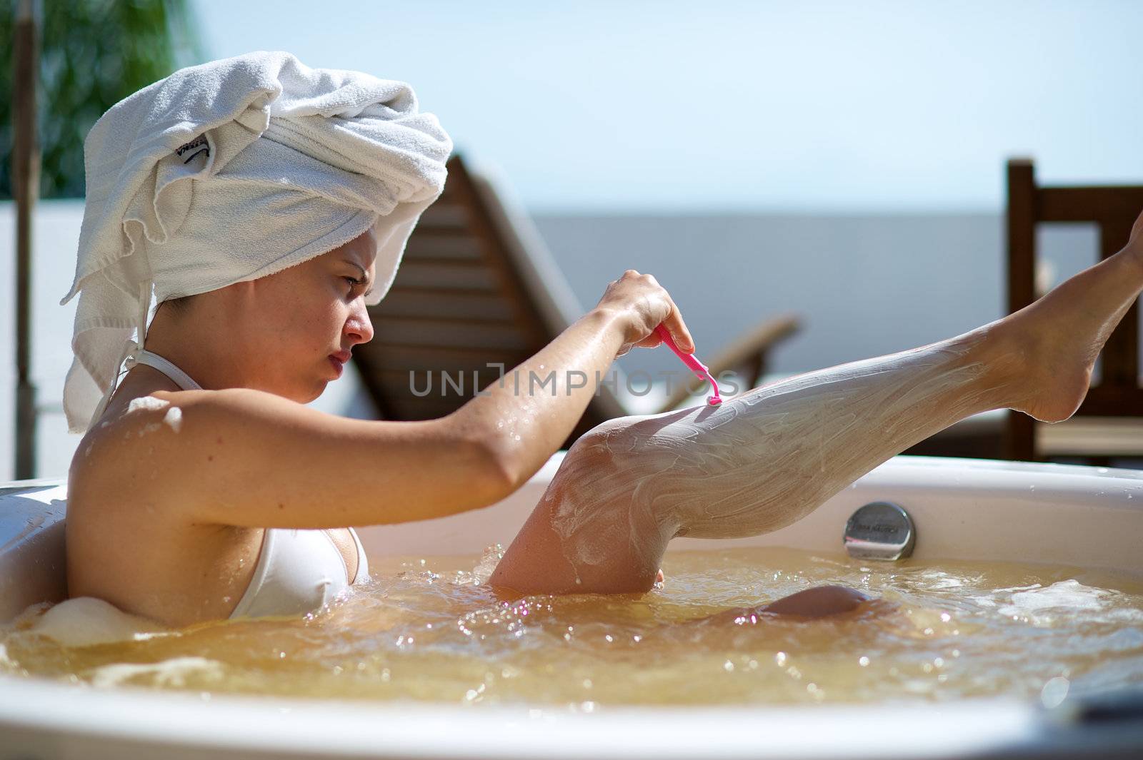 Woman relaxing in a jacuzzi in a resort in Porto Belo, Santa Catarina, Brazil