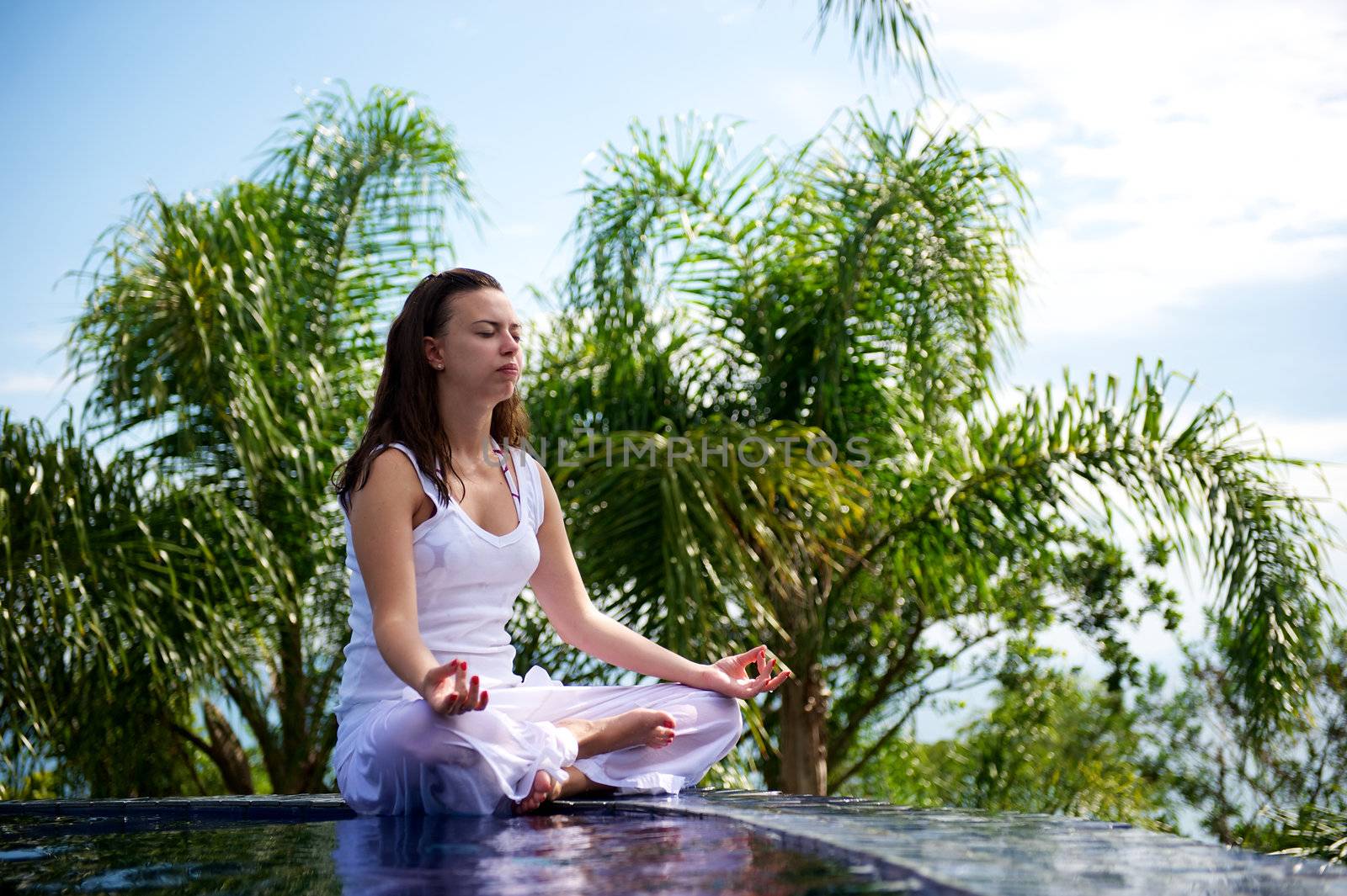 Woman relaxing in a paradise swimming pool in a resort in Porto Belo, Santa Catarina, Brazil