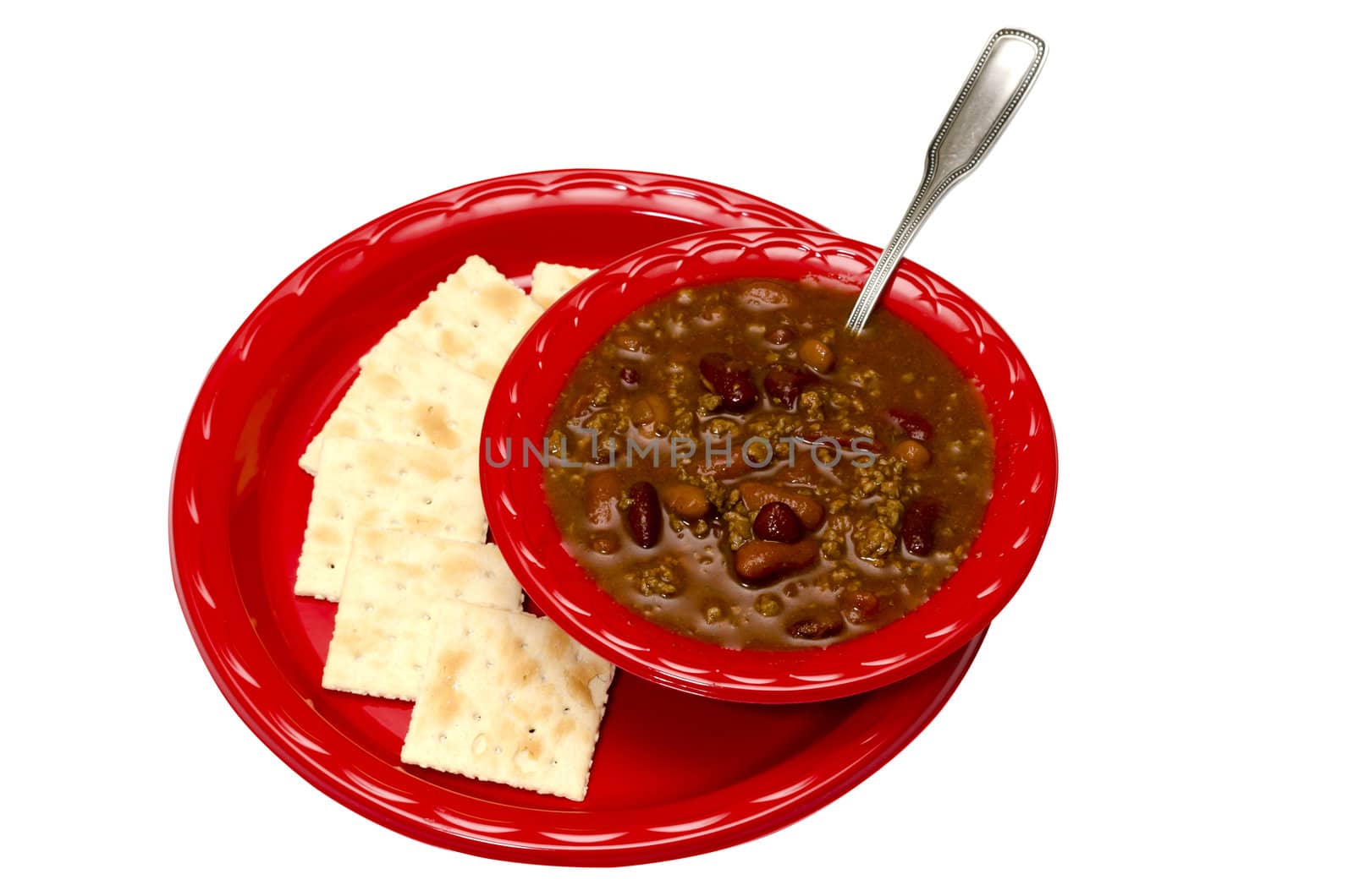 Bowl of chili with saltine crackers isolated on white background with clipping path.