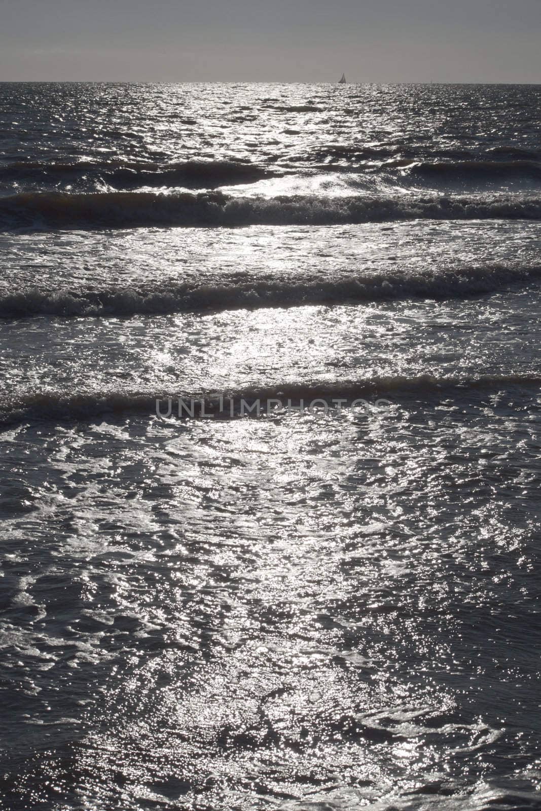 Sun light reflection on the beach in Tuscany, Italy.