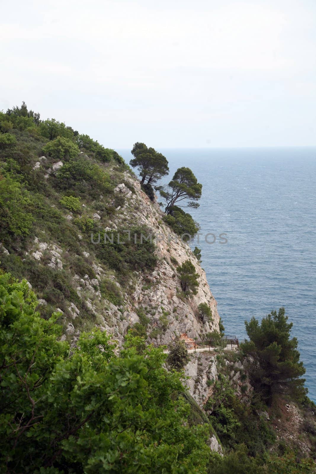 Pictorial blue Adriatic sea with rocks