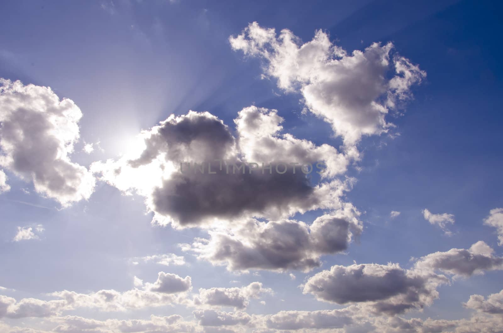 Wonderful view of sky with some clouds. Sun rays trying penetrate through the clouds.