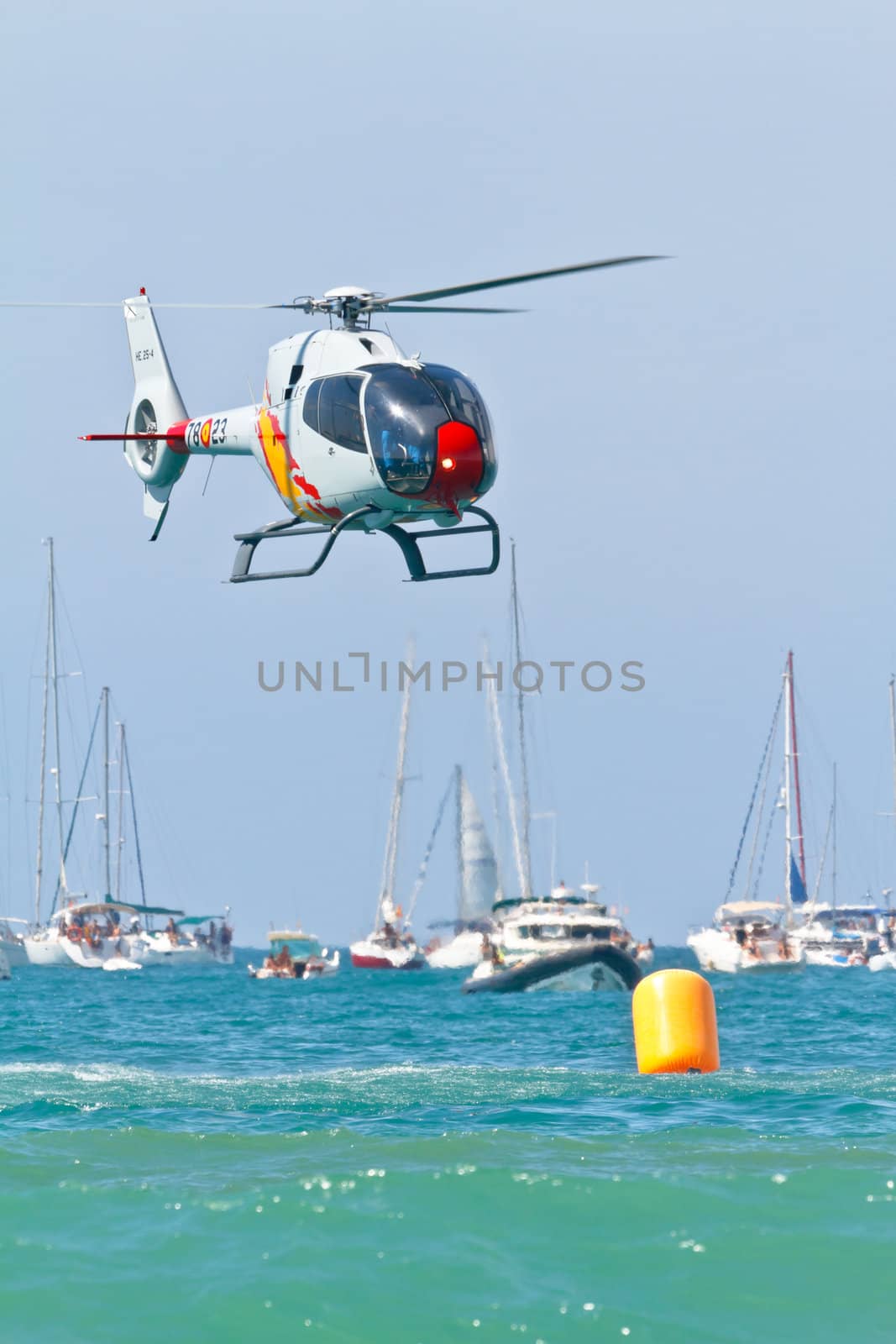 CADIZ, SPAIN-SEP 11: Helicopters of the Patrulla Aspa taking part in an exhibition on the 4th airshow of Cadiz on Sep 11, 2011, in Cadiz, Spain