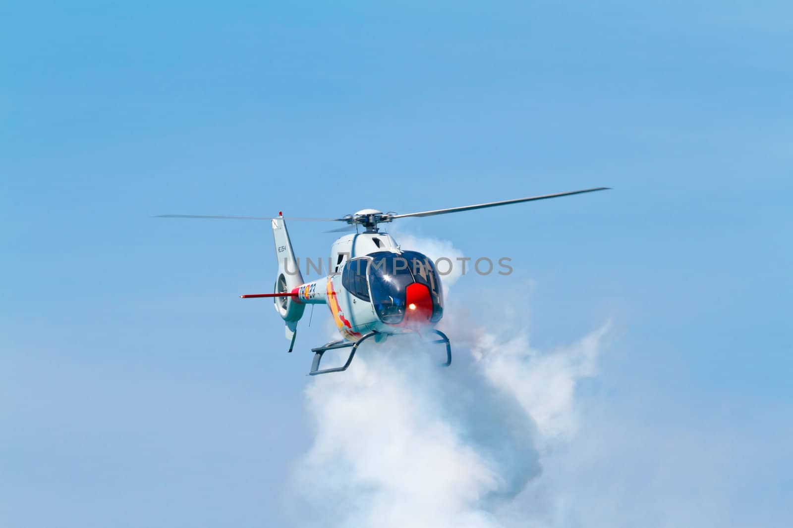 CADIZ, SPAIN-SEP 11: Helicopters of the Patrulla Aspa taking part in an exhibition on the 4th airshow of Cadiz on Sep 11, 2011, in Cadiz, Spain