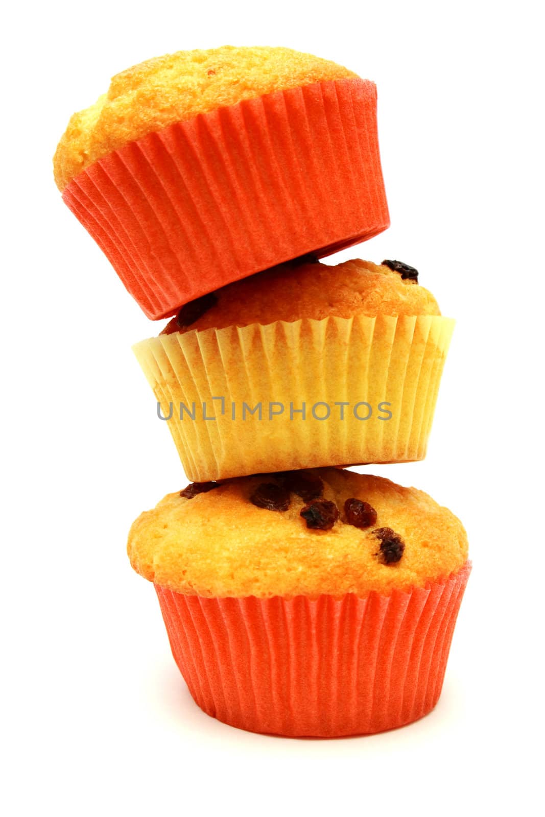 Tasty yellow three muffins on standig each other