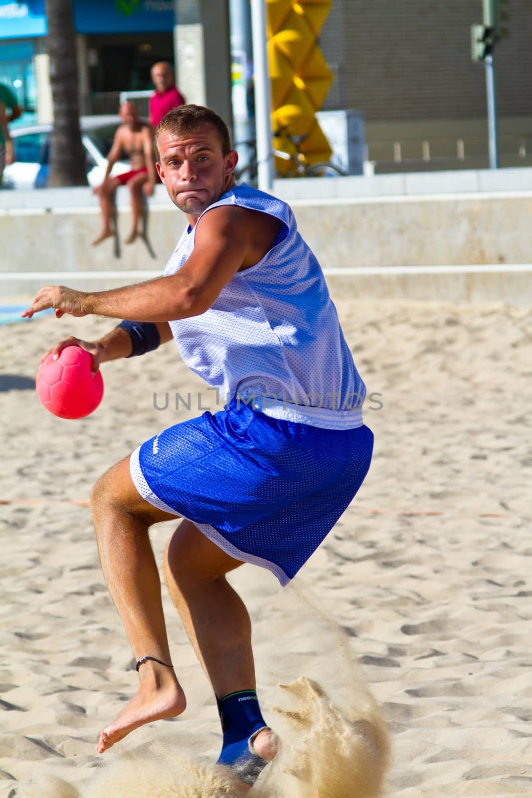 CADIZ, SPAIN - JULY 19: Unidentified players compete in a match between Los Negritos and Ademar Adentro in the 19th league of beach handball of Cadiz on July 19, 2011 in Cadiz, Spain