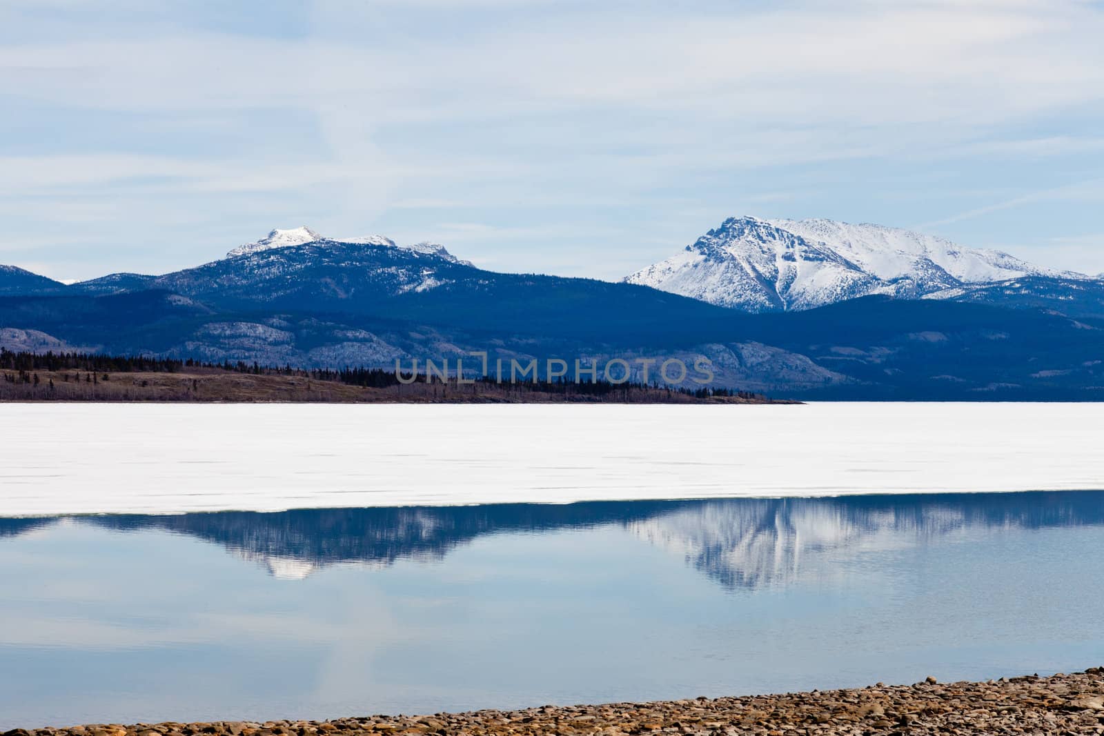Snowy Mountains mirrored on Lake Laberge, Yukon, Canada by PiLens