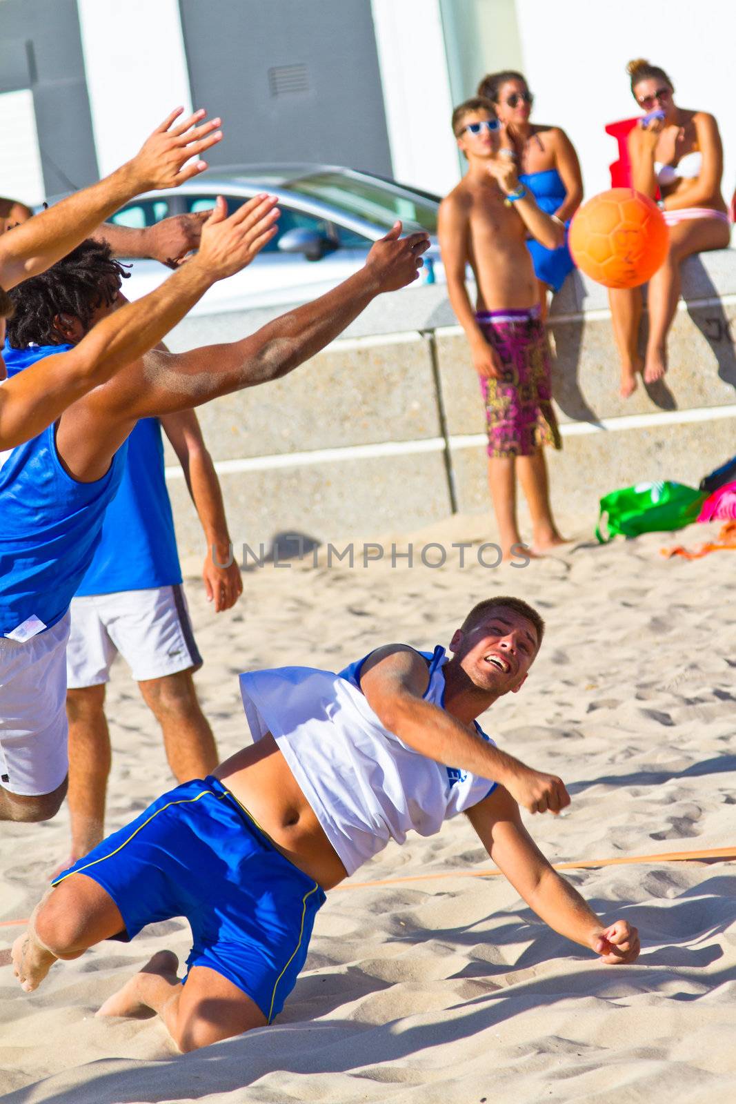CADIZ, SPAIN - JULY 19: Unidentified players compete in a match between Valcarcel Recuperado and DecoHogar in the 19th league of beach handball of Cadiz on July 19, 2011 in Cadiz, Spain