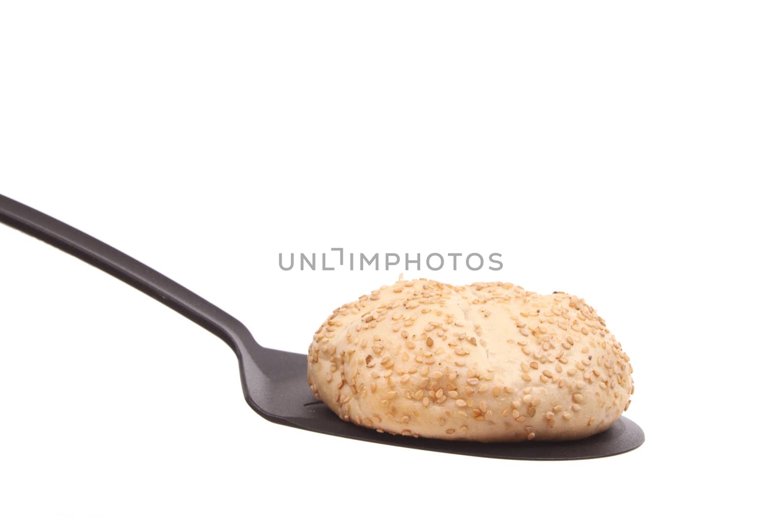 Bun on a spoon against a white background