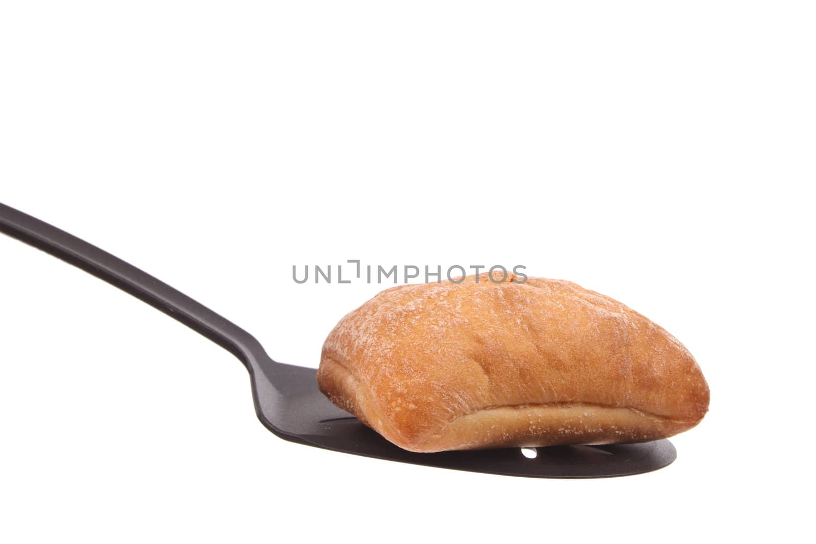 Bun on a spoon against a white background