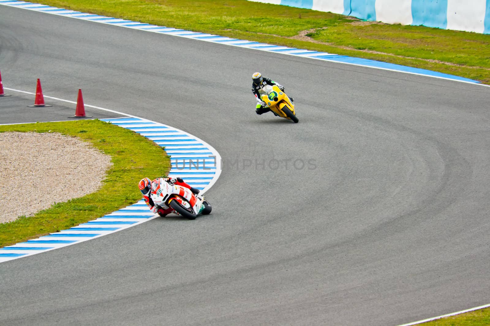 JEREZ DE LA FRONTERA, SPAIN - MAR 5: Moto2 motorcyclist Bradl and Corsi races on the official training of the  world championship of MotoGP on Mar 5, 2011, in Jerez de la Frontera