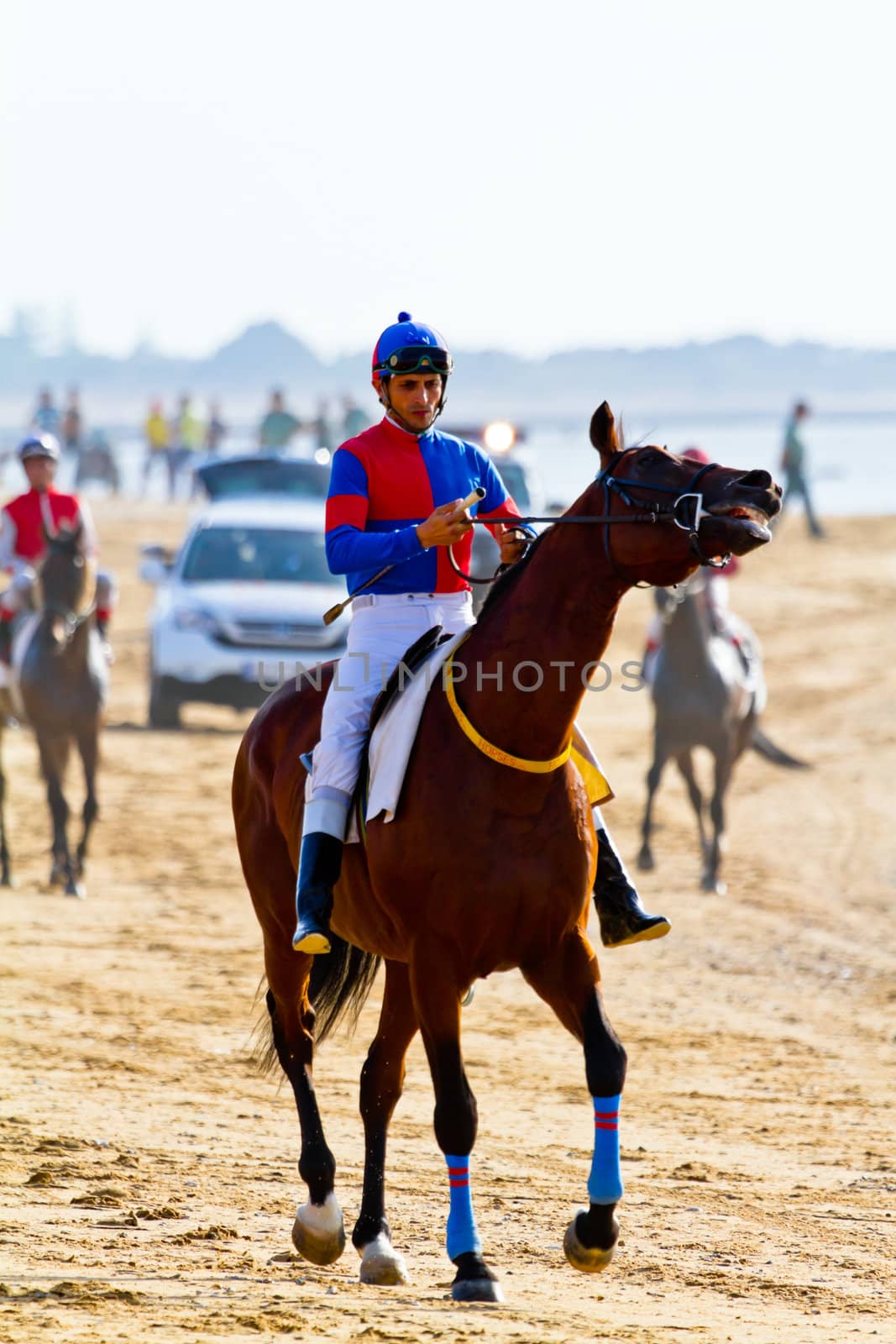 SANLUCAR DE BARRAMEDA, CADIZ, SPAIN - AUGUST 10: Unidentified rider at the start of race horses on Sanlucar de Barrameda beach on August 10, 2011 in Sanlucar de Barrameda, Cadiz, Spain.
