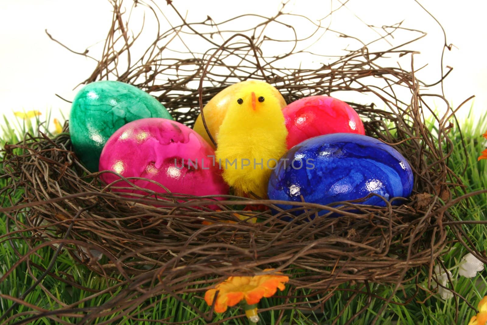 Easter basket with Easter eggs and chicks by discovery