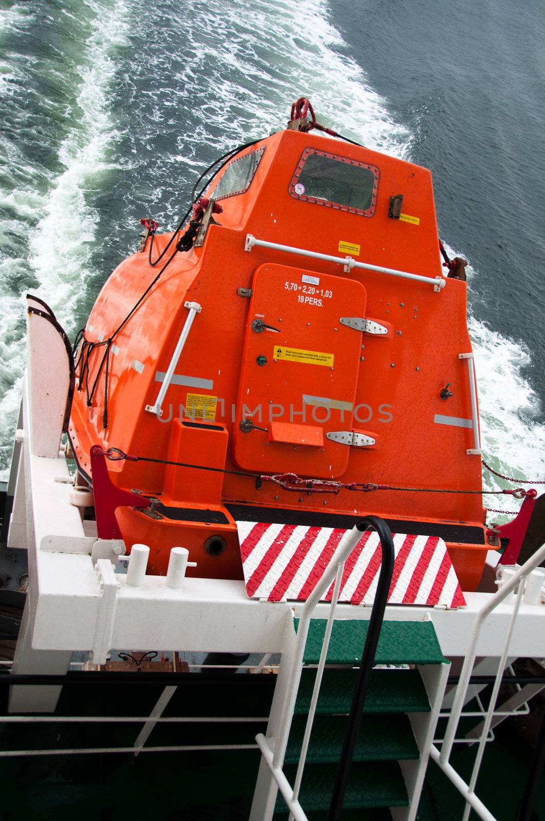 A freefall lifeboat on a cargo ship ready for rescue