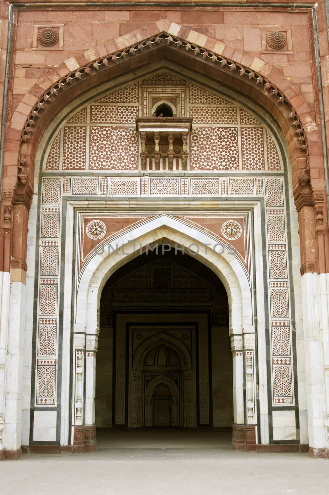 Ornate entrance to the ancient mosque (Qal'a-i-Kuhna) inside the historic fort of Purana Qila in Delhi, India. 16th Century AD.