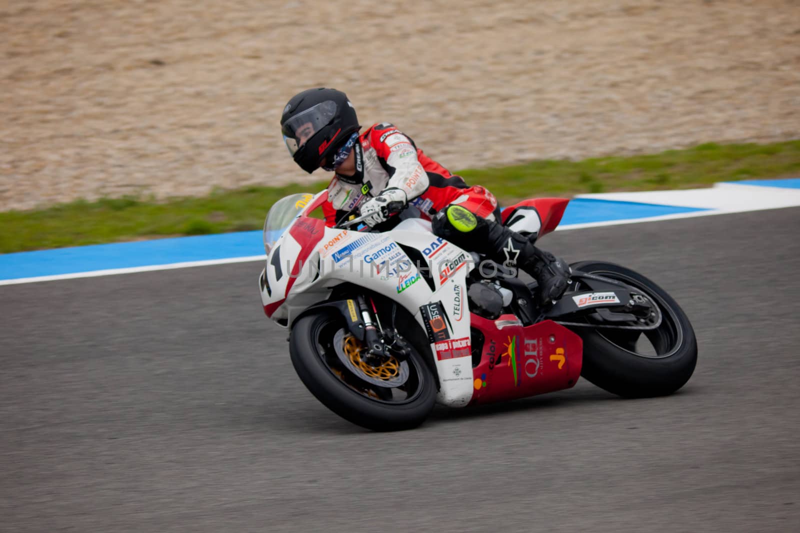 JEREZ DE LA FRONTERA, SPAIN - NOV 20: Stock Extreme motorcyclist Didac Fernandez takes a curve in the CEV championship on Nov 20, 2010, in Jerez de la Frontera, Spain
