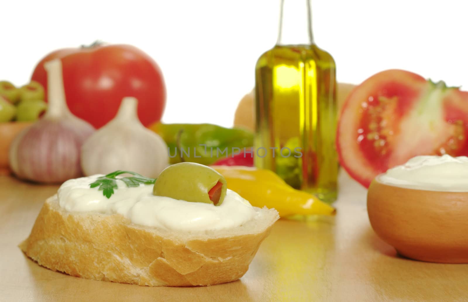 Baguette with cream cheese, olive and other fresh vegetables