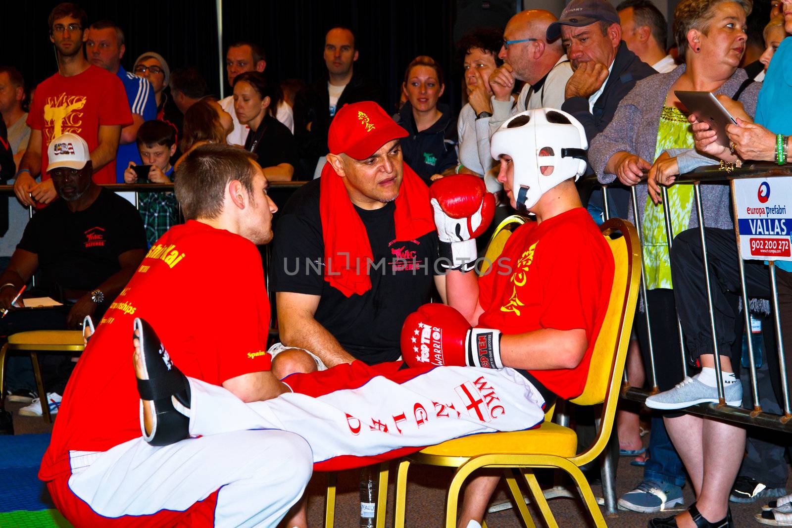 CHICLANA DE LA FRONTERA, SPAIN-NOV 05: Unidentified players with her trainer compete in the 3rd World Karate and Kickboxing Council championship  on Nov 05, 2011, in Chiclana de la Frontera,  Spain