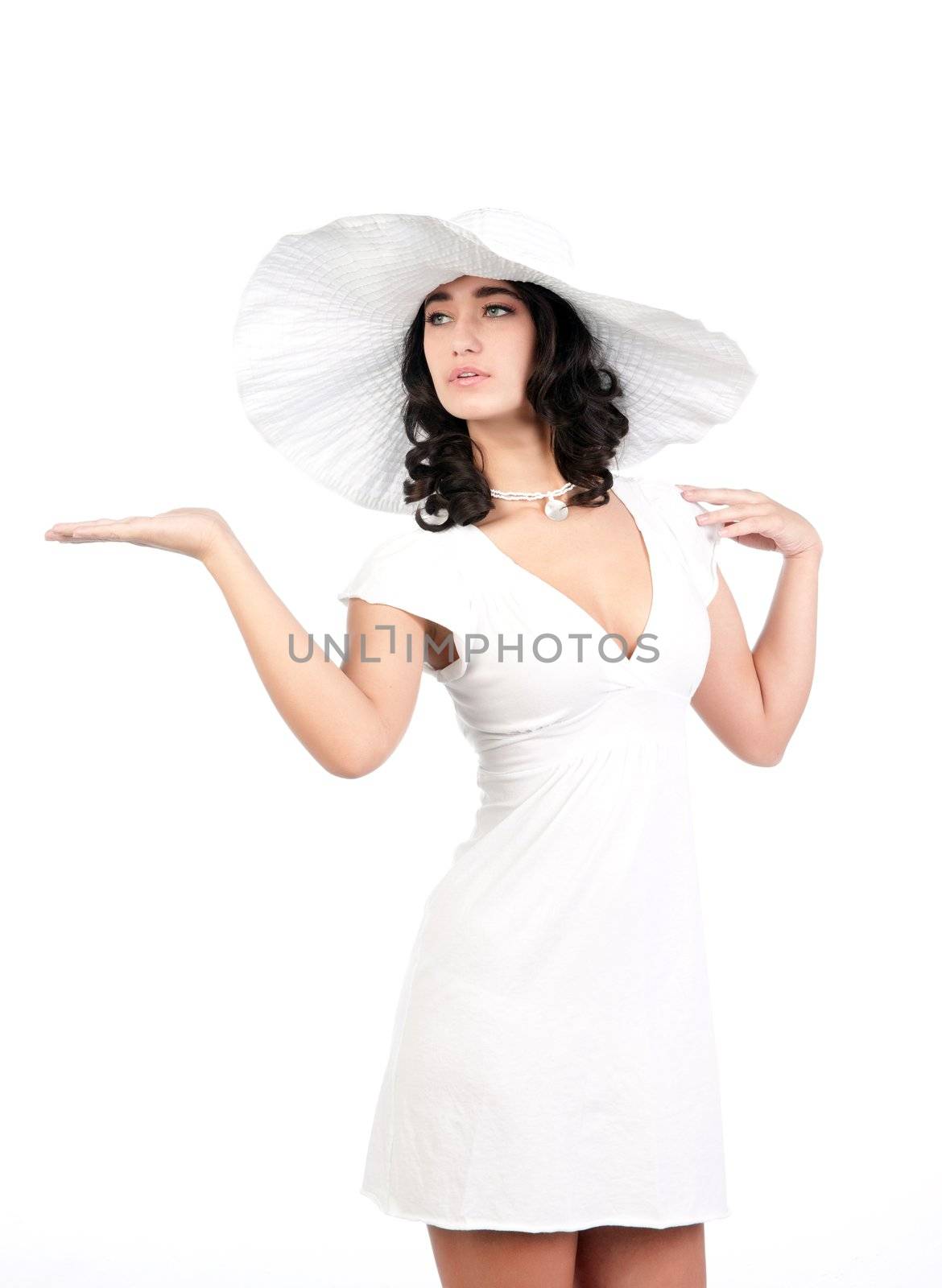 beautiful young fashion woman in white dress and hat with hand out