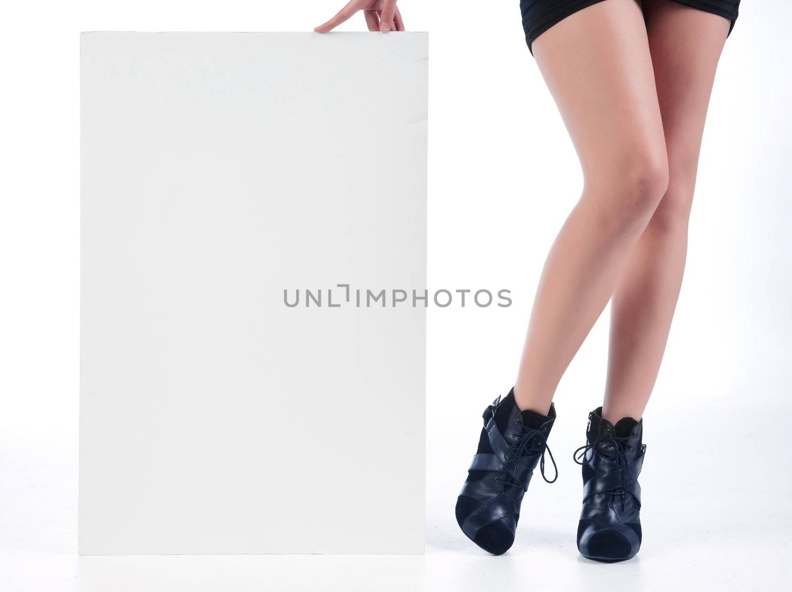 isolated sexy womans legs dressed for nightclub with white sign