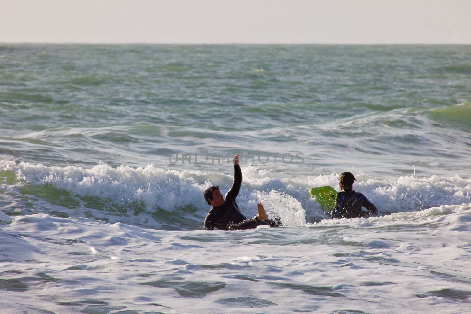 SAN FERNANDO, CADIZ, SPAIN - FEB 19: Unknown surfer taking waves on the 2nd championship of Surf and BodyBoard Impoxibol on Feb 19,2011 on the beach of Camposoto of San Fernando, Cadiz, Spain