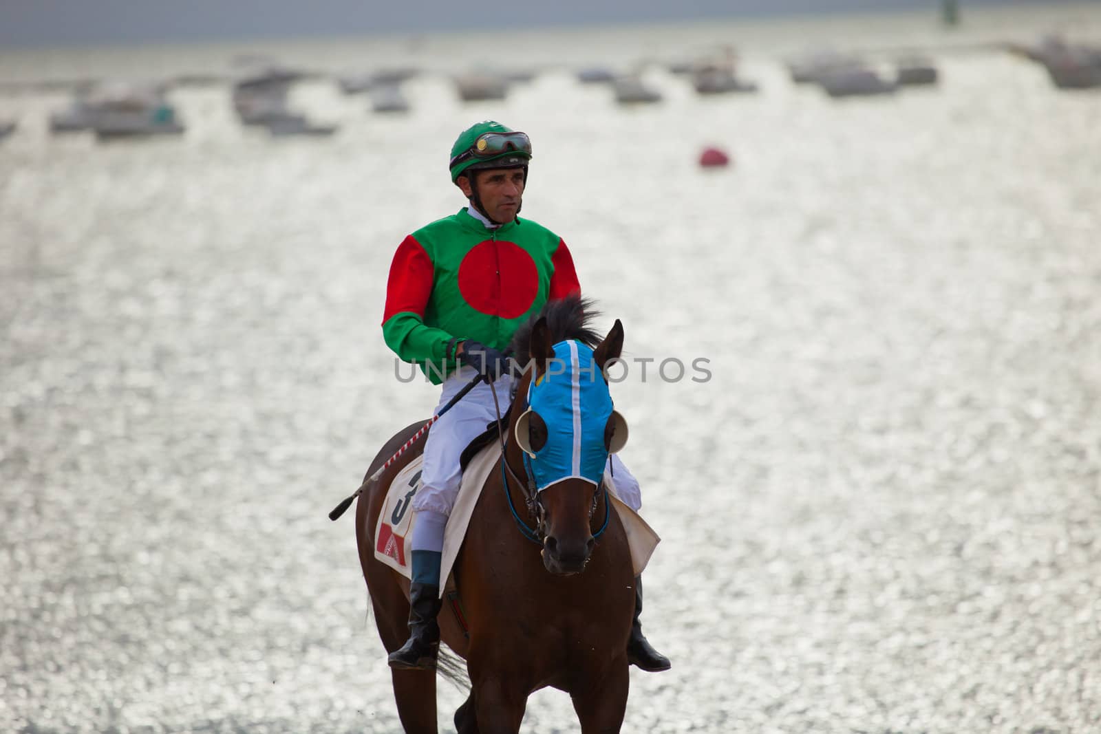 SANLUCAR DE BARRAMEDA, CADIZ, SPAIN - AUGUST 07: Unidentified rider at the start of race horses on Sanlucar de Barrameda beach on  August 07, 2010 in Sanlucar de Barrameda, Cadiz, Spain.