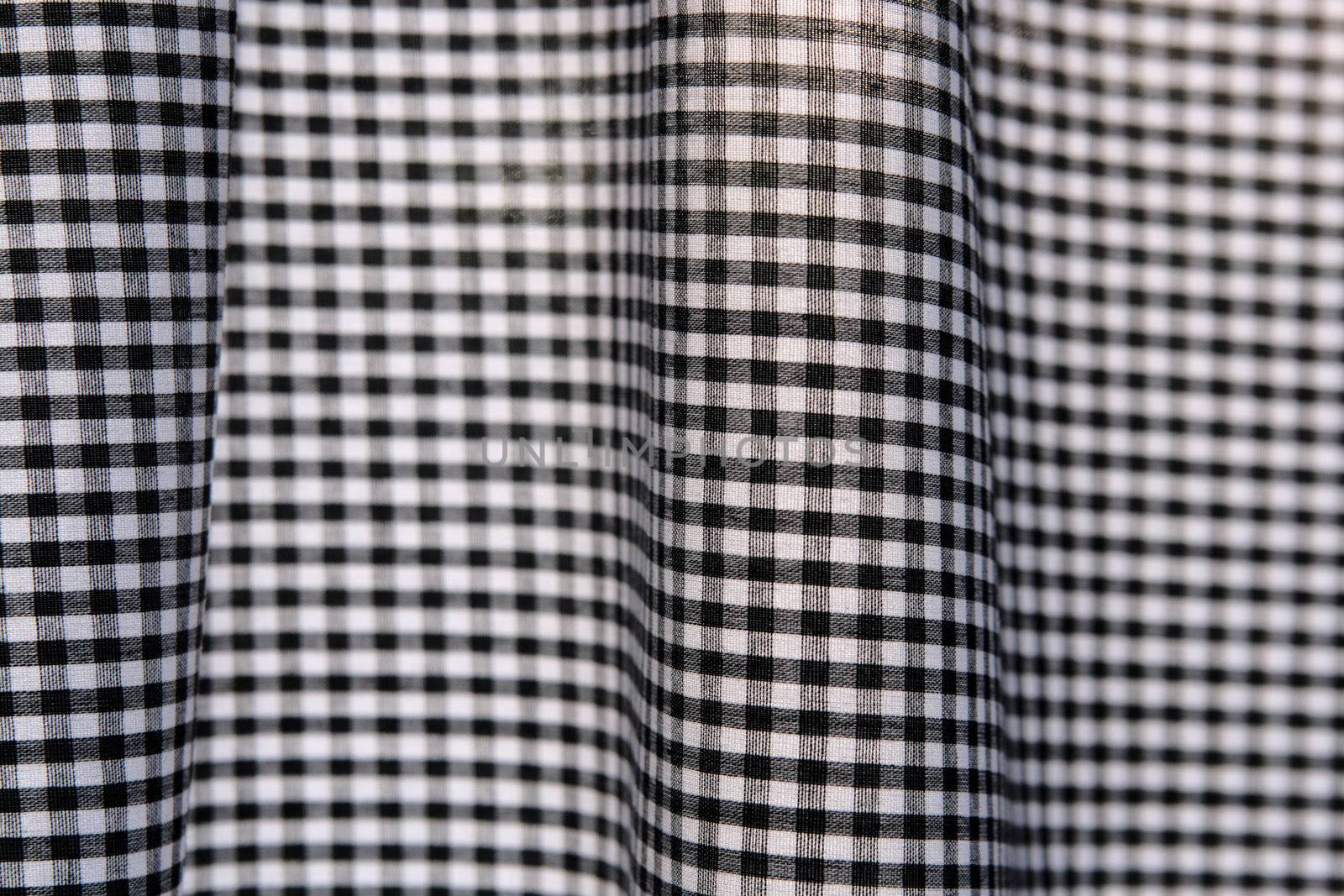 black and white gingham checks that give an op art or psychedelic effect