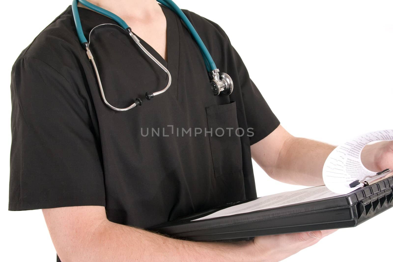 Doctor in scrubs looking at chart wearing a stethoscope