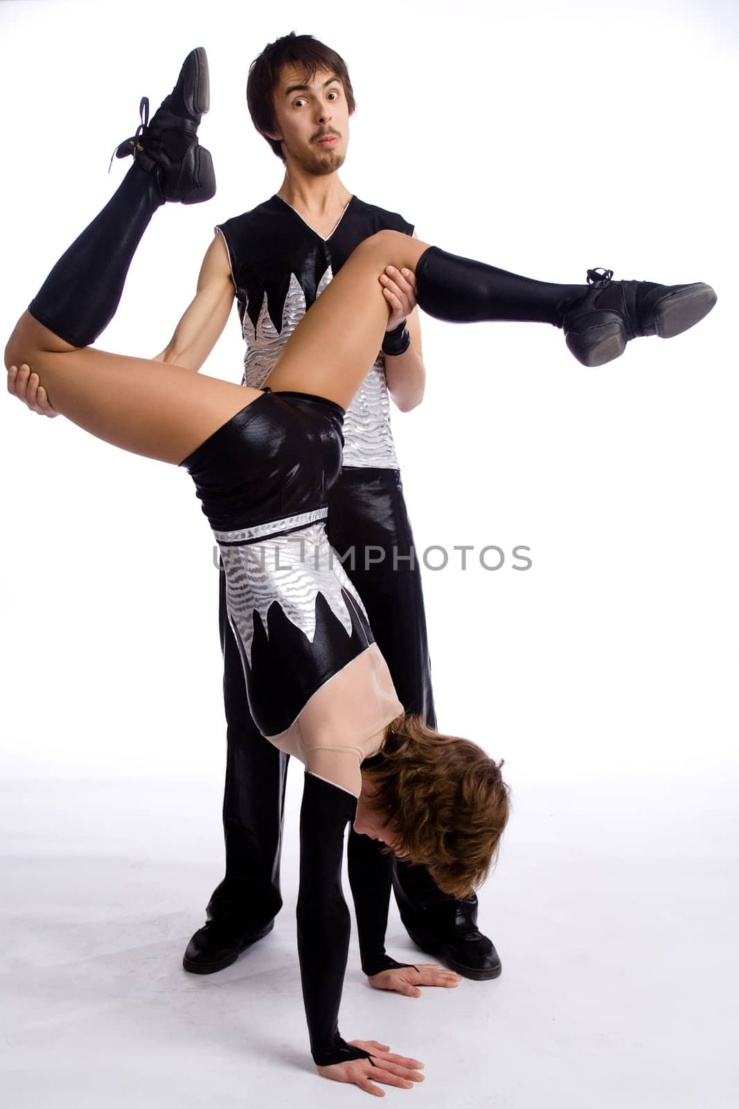 two dancers in same costumes on white
