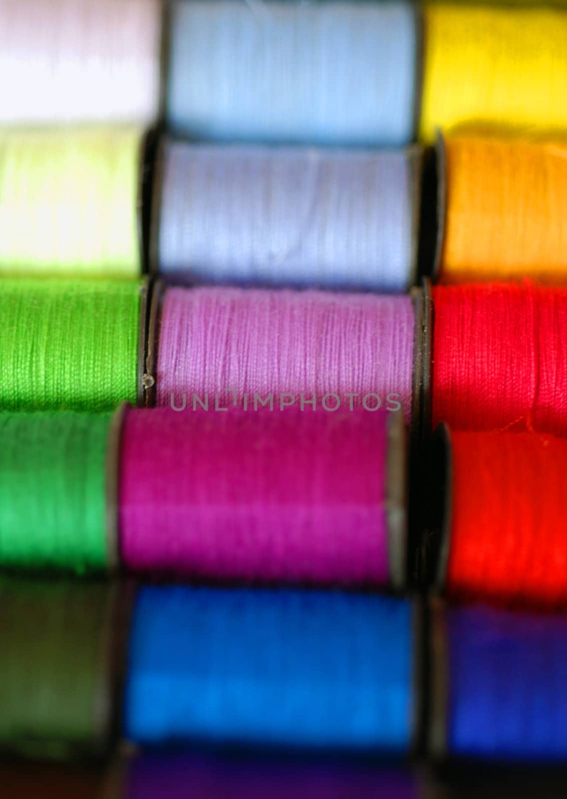 Colourful spools of cotton by pwillitts