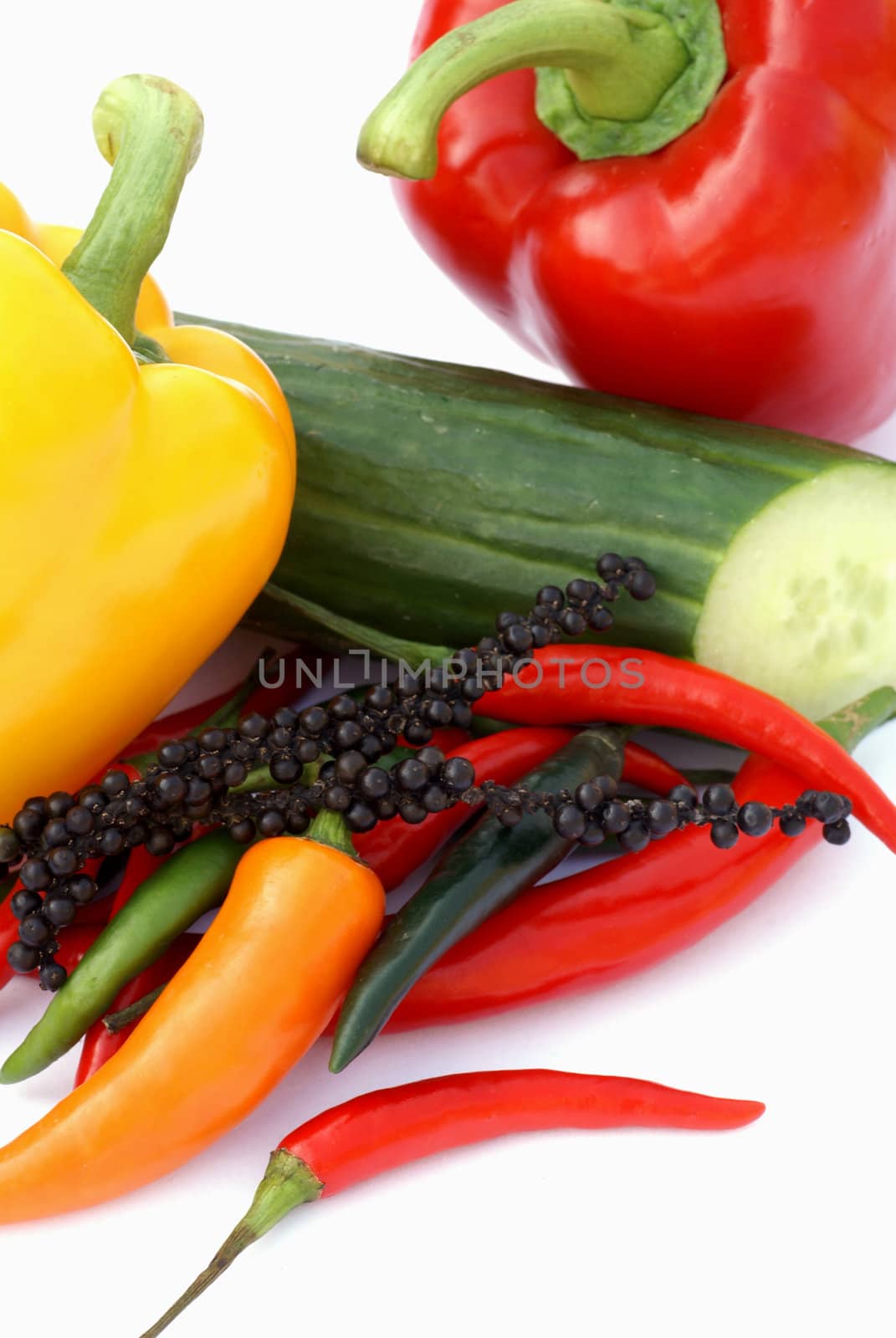 Isolated paprika, cucmuber and different kinds of pepper. 