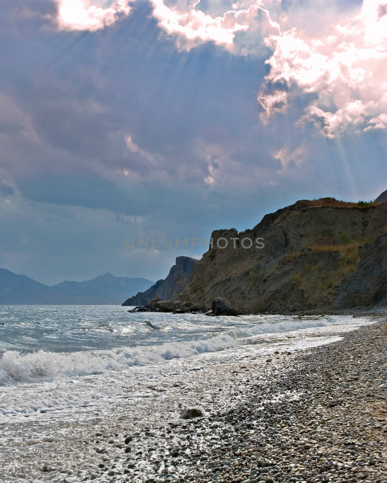 Dawn in the storm sky on sea coast