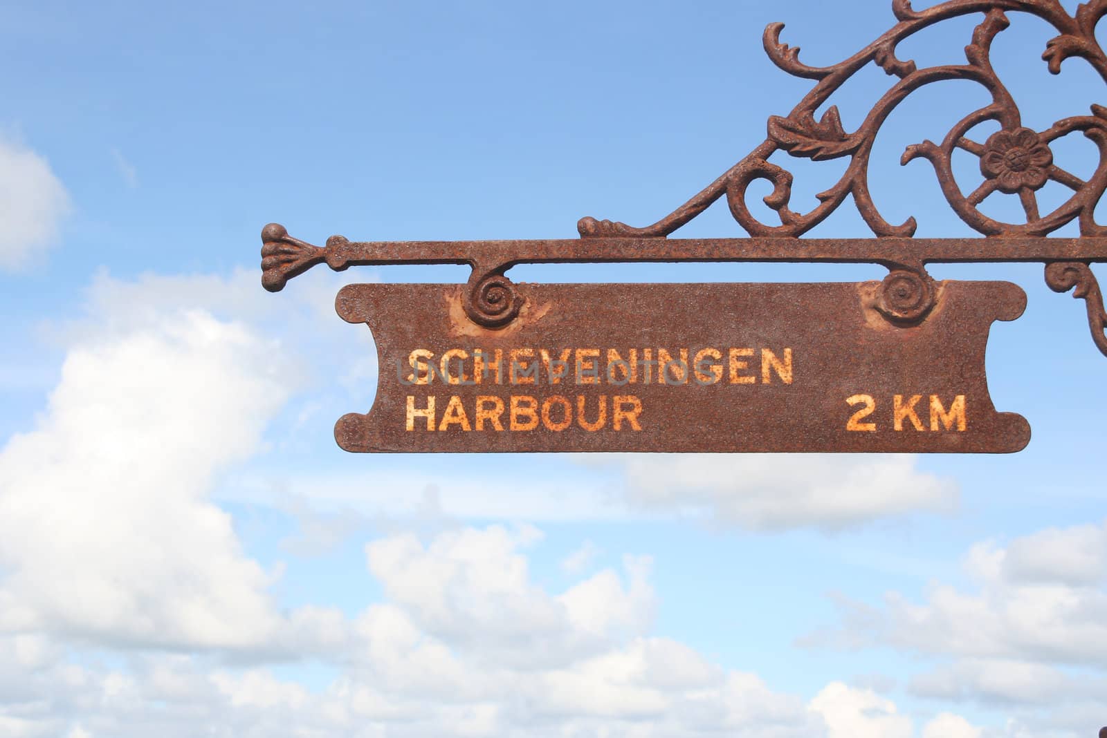 Rusty sign at the Dutch beach resort of Scheveningen saying Scheveningen Harbour