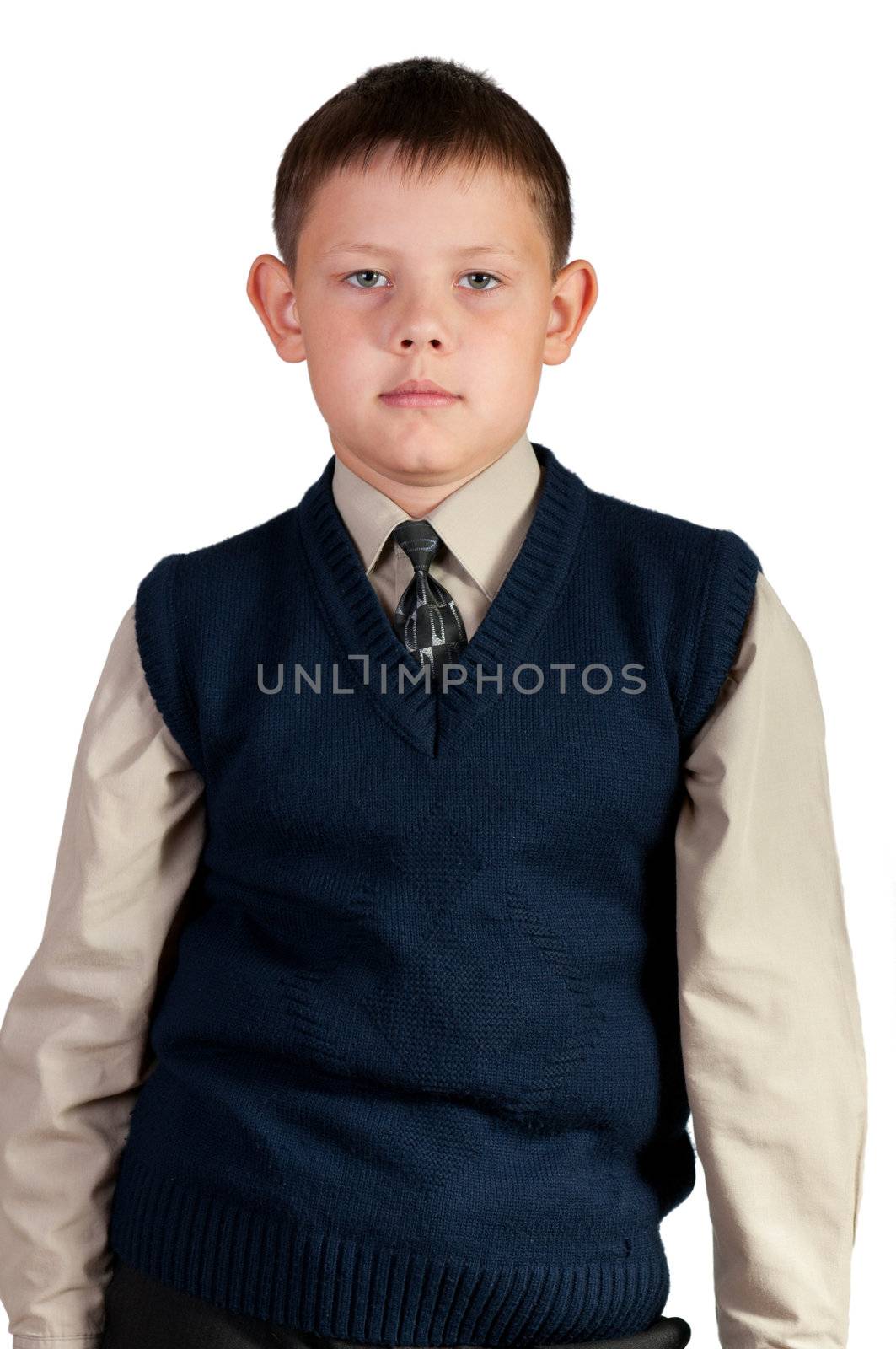 Schoolboy. Isolated over white background. The boy is dressed in a vest.