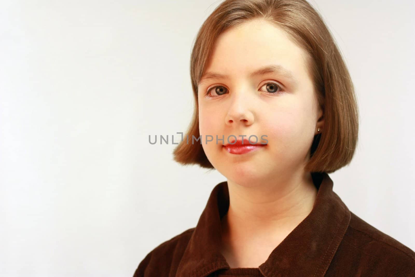 Pretty young girl with short brown hair.