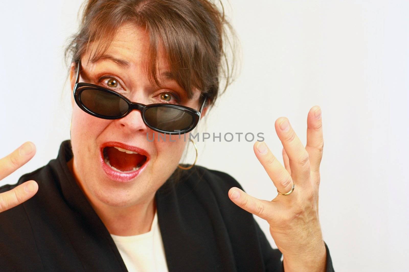Brunette haired woman expressing  frustration with hands.