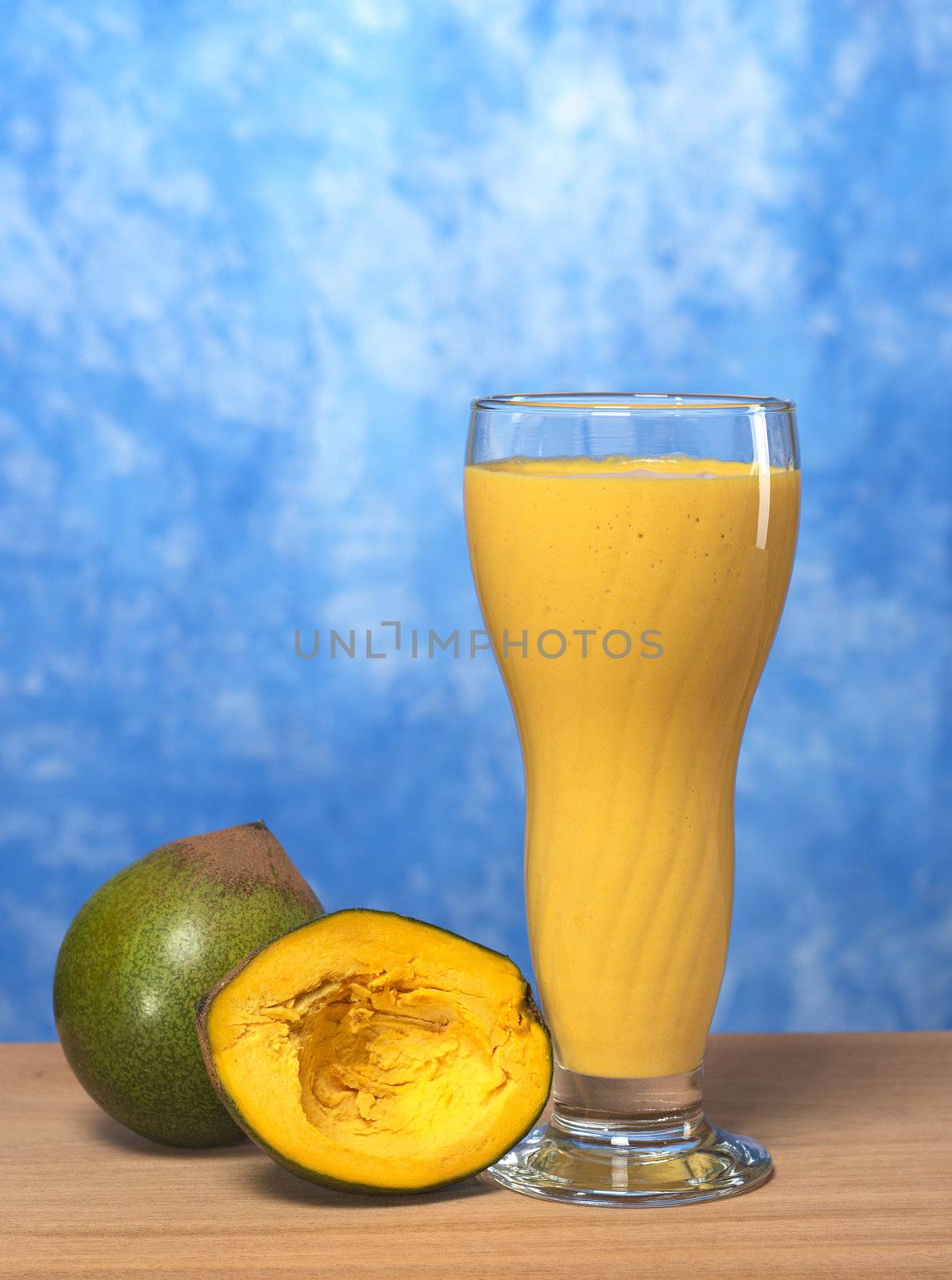 Milkshake out of the Peruvian fruit called Lucuma (lat. Pouteria lucuma) grown in the Andean region of Peru, which is very popular in Peru (Selective Focus, Focus on the front)